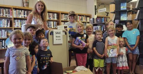 The Post Public Library Summer Reading program ended last week. The kids are presenting Pixie Grisham with boxes of food collected for Post Cares. The library took in cans of food with overdue books along with fines forgiven. Librarian Pam Humble said the food drive was a success. PHOTO PROVIDED