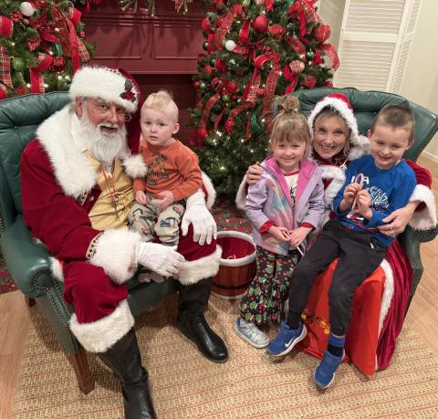SANTA LISTENS to the Tara and Trent Lawrence family at last week’s Light Up Post evening.