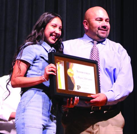 VALEDICTORIAN PHS Principal Sol DeLeon presents Abigail Rodriguez with the 2024Valedictorian Award during the Academic Awards Ceremony on Monday. Abigail is the daughter of Steve andMineraRodriguezandgranddaughterofGusandIrmaGomez. She has earned 50 dual credits. After high school, Abigail plans to attend LCU and work toward a Bachelor of Science degree in Nursing. | JULIA CHILDS PHOTO