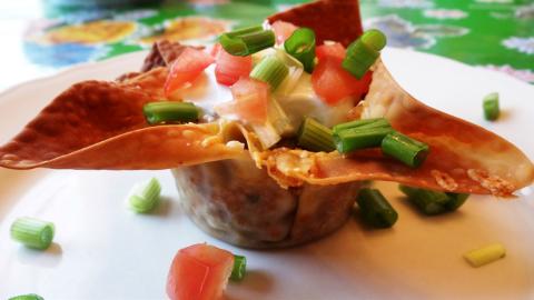 PARTY PREP Taco cups in muffin tins can be created by brushing egg-roll or wonton wrappers with oil to crisp in the oven, eliminating the need to for deep frying. | ANGELINA LaRUE PHOTO