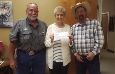 FUNDRAISER Masonic Lodge 2058 of Post presents a check to Garza CountyTrailblazers in the amount of $4,068 to help with the replacement of an air conditioner for the center. Presenting the gift to LaGayluah McReynolds are David Clark, currentWorshipful Master, and MarkWheeler, past Worshipful Master, of Masonic Lodge 2058. The gift is the result of a raffle fundraiser held by the lodge over the last three months. | COURTESY PHOTO