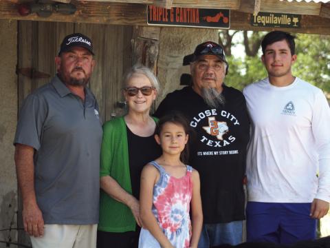 FARMERS HELP The Gonzales family was on the receiving end of their neighbors' help this past week when farmers showed up to work the fields. This family is waiting for the group to finish from the left Steve, Susan, Sophia, Danny and Stevie. | STAFF PHOTO