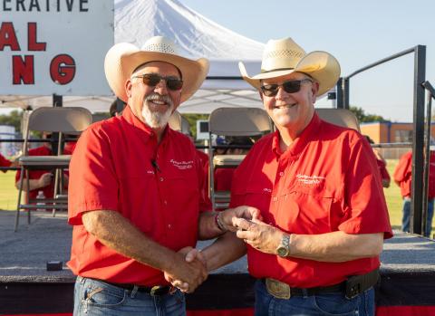TIME TO RETIRE AND RAISE COWS Greg Henley (right) will retire as CEO of Lyntegar Electric Cooperative this month after a 40-year career with the cooperative. Board president Ben Franklin presented a token of appreciation from the organization. | COURTESY PHOTO