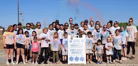 CHILD ADVOCACY Participants gather after the Garza County Child Welfare Board’s inaugural Color Run in Post, covered in colored powder following the race to raise awareness for child abuse prevention. SEE MORE PHOTOS PAGE 8 | COURTESY PHOTO