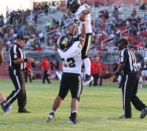 Celebrating by flying high, Bold Gold player Alejandro Rodriguez (Sr.) lifts up running back Ian Vergara (Jr.) as they celebrate a successful play. ABIGAIL RODRIGUEZ PHOTO