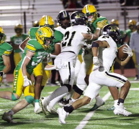 ANTELOPES FALL Senior Colin Carson, #21 blocks for Junior Running Back Ian Vergara, #6, during he Bold Gold Antelopes season finale. | ABIGAIL RODRIGUEZ PHOTO