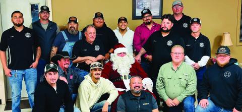 SANTA VISIT Santa made a special visit to the Post Volunteer Fire Department during their annual Christmas part last week. The department met at Garza County Trail Blazers for a meal before receiving their annual check for the calls they attended during the year. | COURTESY PHOTO