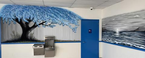 Murals painted by a Dalby Correctional Facility trustee brighten the entrance and visitation area, part of TDCJ’s efforts to create a more welcoming environment for individuals visiting the facility.