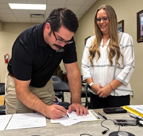 NEW BOARD MEMBER Brandy Fannon administered the oath of office to Dakota McDonald, who was appointed to fill the open Precinct 1 position on the Garza County Healthcare District Board during its Sept. 16 meeting. | COURTESY PHOTO