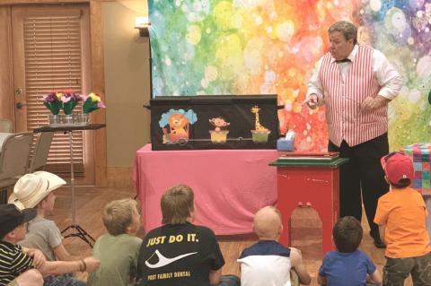 LIBRARY MAGIC The Post Public Library held a special event with“Rick the Magician”during the summer reading program at the Heritage House last Tuesday. MORE LIBRARY FUN AND GAMES, PAGE 3 | POST DISPATCH
