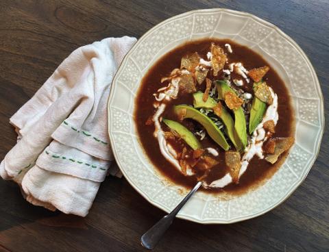 MEXICAN SOUP Sopa Tarasca a traditional Mexican soup that is rich and hearty dish features a delicious blend of flavors, combining ingredients of tomatoes, garlic, onion, and various spices. The soup is enriched with chicken and garnished with avocado, cheese, and sour cream, providing a delightful contrast of textures and tastes. | ANGELINA LARUE PHOTO