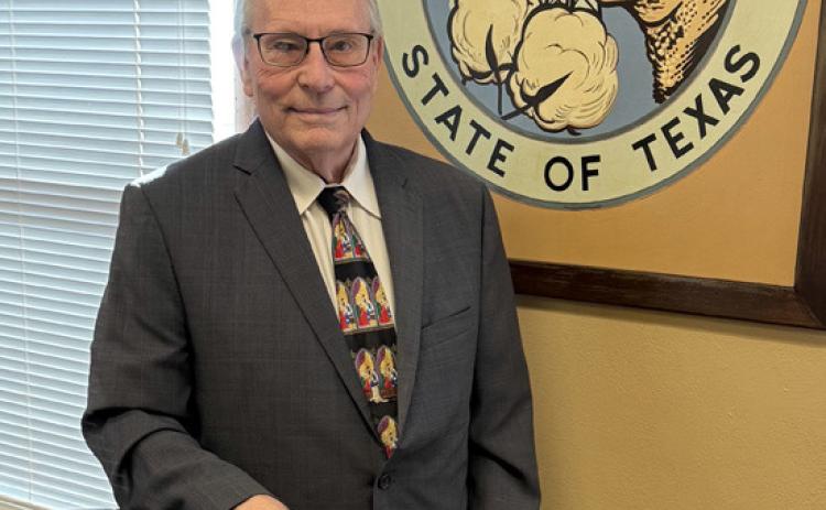 LONGTIME LEADER Judge Lee Norman stands in front of the Garza County Seal as he enters his final year in office, capping nearly two decades of dedicated service and community leadership in West Texas. | STEPHANIE ALLEN