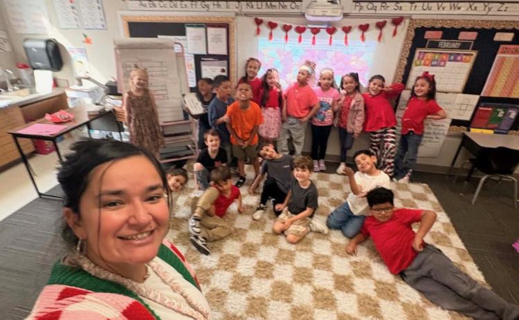 FRIENDSHIP AND FUN Kindergarten and first-grade students at Post Elementary celebrate Valentine’s Day, as families joined the festivities. | COURTESY PHOTOS