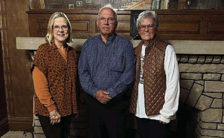 Standing in front of the fireplace at the C.W. Post on Main Street are Amity President Marsha Norman, Curtis Hudman, and Vice President Nancy Thuett. PHOTO PROVIDED