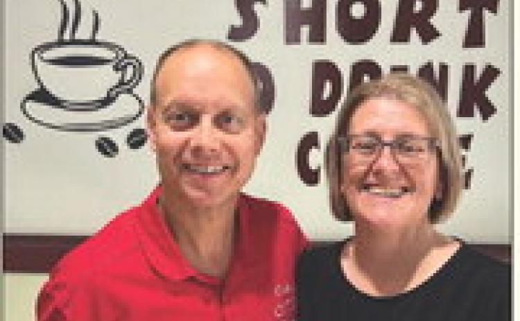 COFFEE WIZARDS Jeff and Dawna Hood, owners of Coffee Wizards, are celebrating the fifth year on North Broadway with a community giveaway on Monday, June 9. Stop by to spin the prize wheel, enter to win merch, and catch the live drawing on Facebook at 3 p.m.! See the article for details. | COURTESY PHOTO