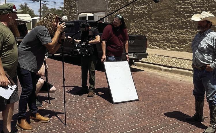 FILM CREW - Calina Mishay, mural artist, and her film crew were in the Post last week to capture scenes around town and interview people for her new TV series called Cal’s Hometown Revival. Jeff Williams is shown talking about the mural painted downtown and the significance the mural paintings have had on Post. Cal’s Hometown Revival will air on Destination America by Discovery starting October 1. More information as the date gets closer. | STAFF PHOTO