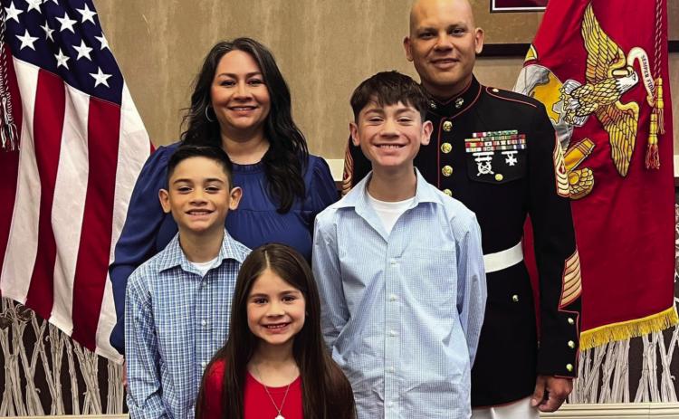Sgt.MajorOrlandoCastillostandswithhisfamilyduringhisUSMCretirementceremony. | COURTESYPHOTO