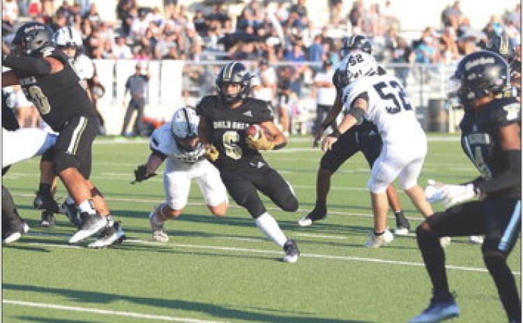 IANVERGARA, a junior running back, was injured on the first drive of the game. AlthoughVergara’s sprained ankle was taped, Head Football Coach John Wright said the injury was too significant to continue playing. | ABIGAIL RODRIGUEZ PHOTO