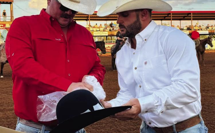 TOP HAND AWARD Tobe Palmer was named the 2024 Premier Top Hand Award at the Post Stampede Rodeo last weekend. Brandon Blacklock, owner of Premier Auto, presented Tobe with the award. Only the men behind the Post Stampede Rodeo truly understand what it takes to make an event of this magnitude possible! Late nights and long hours are just part of being one of the directors of the rodeo. | COURTESY PHOTO