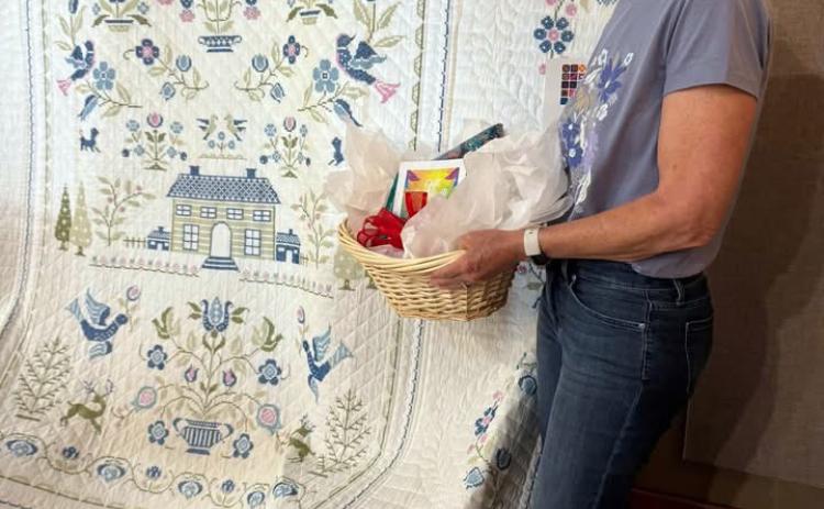 PEOPLE’S CHOICE Joann Travis took the People’s Choice award for her cross-stitch quilt, which she made in her twentiess and was later quilted by a neighbor, during the Garza County Quilt Show on Saturday, May 2, in Post. | COURTESY PHOTO