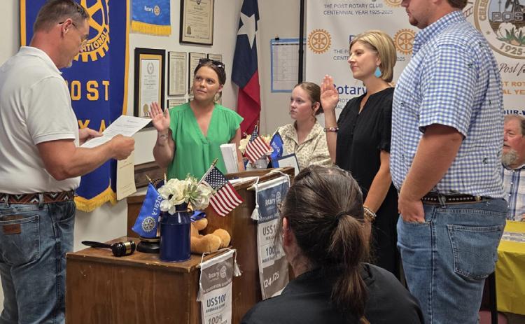 MEMBER INDUCTION Rhett Parker, led the induction of new Post Rotary Club members Traci Jarrett, left, and Stephanie Allen during the club’s June 9 meeting. | COURTESY PHOTO