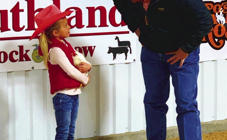 CHICKEN SHOW Pee-Wee Ellisyn Johnson opened the Southland Junior Livestock Show by showing her hen named King Bob last Saturday, Jan. 4. The Junior Livestock Show winners circle records and photos from both Southland and Post will be published in the Jan. 17 issue. | ANNA GIBSON PHOTO
