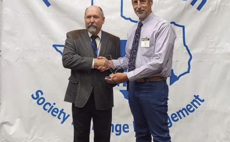 NCRS HONORS Doug Tolleson, President of the Texas Section Society for Range Management (TSSRM), presents the 2023 Grass Roots NRCS award to Range Conservationist Glen Killough of Post, Texas, at the TSSRM annual meeting held in Bastrop, Texas. | COURTESY PHOTO