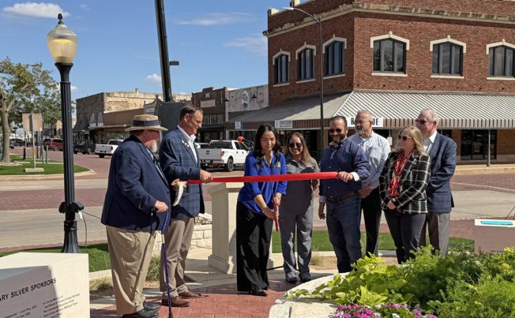 RIBBON CUTTING Post Rotary Club members and community leaders participated in a ribbon-cutting ceremony Monday, Oct. 5, to celebrate the dedication of the club’s Centennial Clock in downtown Post. | STEPHANIE ALLEN