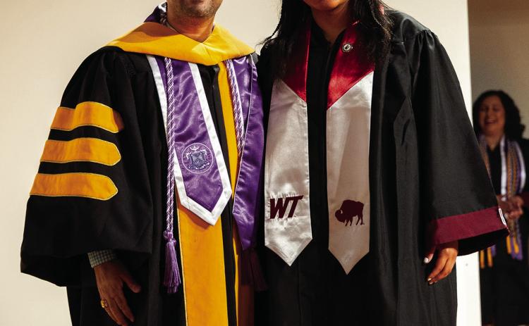 PINNING CEREMONY Marti Cruse stands with Shravan Devkota, WT’s Dr. Wesley L. Langham Professor of Nursing after the nursing pinning ceremony. | COURTESY PHOTO