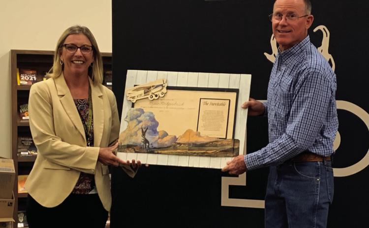 15 YEARS OF SERVICE Drew Kirkpatrick was honored with a personalized handcrafted wall decor at his last school board meeting, Monday, April 7, for his 15 years of service on the Post ISD school board. | ANNA GIBSON PHOTO