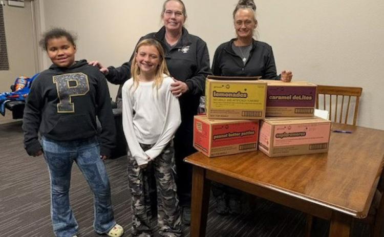 SWEET THANKS Dezariyah Spann and Averie Howell presented Girl Scout cookies to Post EMTs Amanda Hair and Mandi Thompson April 20 as a token of appreciation for their service. See more photos on page 4. | COURTESY PHOTO