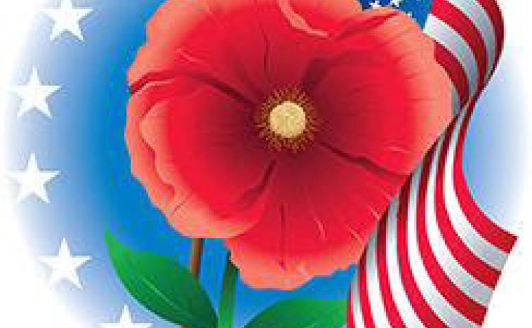 BUDDY POPPY TRIBUTE A bright red Buddy Poppy, the official memorial flower of the Veterans of Foreign Wars since 1922, is a symbol of honoring fallen service members and supporting living veterans. | COURTESY IMAGE