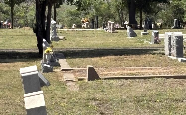 MONUMENT MOVEMENT Headstones stand at varying angles in the Post Cemetery, where natural ground movement and weathering have caused some grave markers to shift. | COURTESY PHOTO
