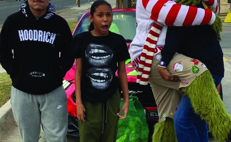 THE GRINCH The WTX Grinch came to Post Monday, December 2. He stopped at McDonald’s from 4 p.m. - 5 p.m. for free pictures. A few locals made their way and took some photos. You may find more photos on page 6 | PHOTOS PROVIDED