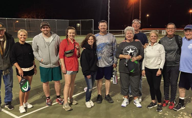 Pickleball players stopped long enough on Monday night for a quick photo. Pictured left to right are Wes Callen, Rhonda Valdez, Trevor and Lindsey Leggett, Debbie and Marcus Owen, Barbara and Charles Hardin, Ruth Torrens, Kary Callen, and George McDonald. Everyone is invited to join the charter members of the Post Pickleball Club each Monday and Thursday at the PISD tennis courts. Photo by Ian Torrens