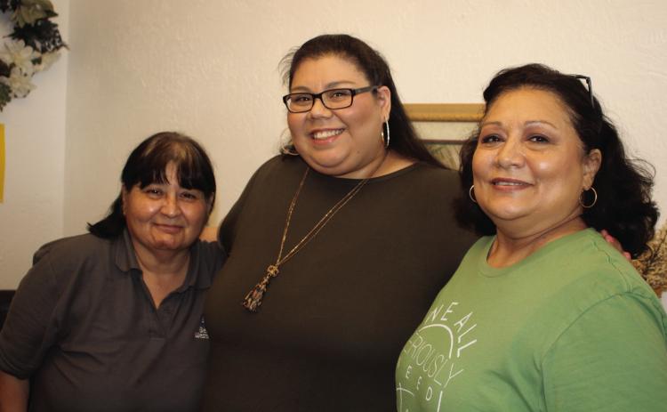 Stephanie Ramirez, Pastor Mari Thacker and Reyes Pequeno members of Bethel Assembly volunteer their time at the Bethel Hope Center. Photo by Julia Childs