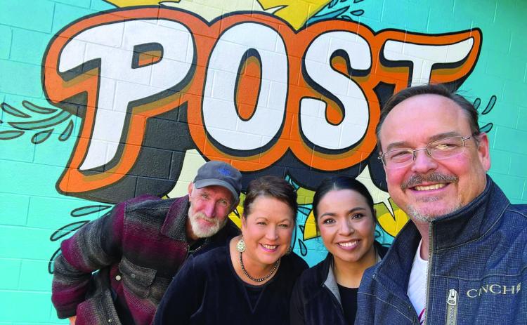 COMMUNITY CENTER City Manager J. Rhett Parker is with Asst. City Secretary Susan Collazo, City Secretary Meg Nelson and City Animal Control and Code Enforcement Officer Eddie Pitts pose in front of the new mural at the Post Community Center. The mural is located in the courtyard at the east entrance of the building and was painted by Street Artist Calina Mishay Johnson. | PHOTO PROVIDED