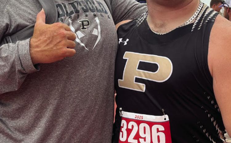 SILVER SHOT Coach John Wright (left) and Post senior Mason Wright celebrated his second-place finish in the shot put May 2, in his third trip to the State meet of his high school career. | RUSS MORRIS