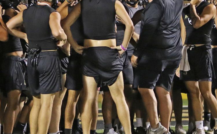 Head Football Coach John Wright addresses the students suited up for the beginning of the 2023 football season. | PHOTO BY ABIGAIL RODRIGUEZ