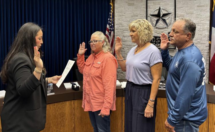 CITY LEADERS Post City Secretary Suzan Collazo (left) administered the oath of office last week to council members Carol Hester, Ward 3; Dianne James, Ward 4; and Jimmy Valdez, Ward 5, during a swearing-in ceremony on June 1 in Post. | COURTESY PHOTO