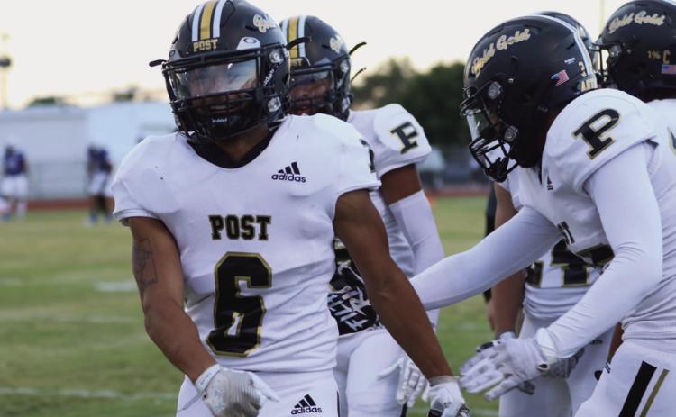 DISTRICT BEGINS Teammates congratulate junior IanVergara on his return to the field and his touchdown to put the Antelopes ahead of the Olton Mustangs 8-0 only three minutes into the first quarter. | ABIGAIL RODRIGUEZ