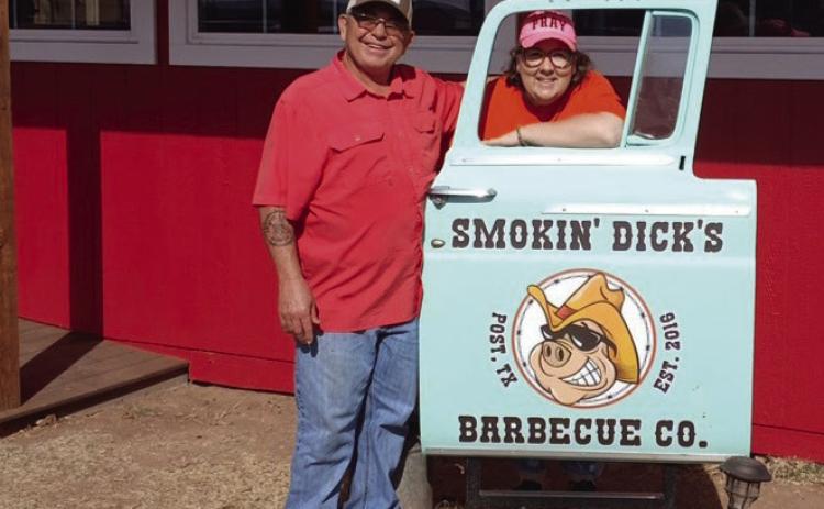 BARBECUE HAVEN Dick and Shellee Odom stand beside their restaurant sign with great big smiles after their newly constructed addition to Smokin’Dick’s Barbecue. They will celebrate their third year on Feb. 14 with a pork chop meal deal from 11 a.m. - 6 p.m. | PAUL GIBSON PHOTO