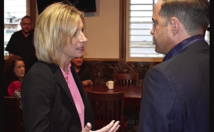 Post ISD Superintendent Cassie Petty visits with Rep. Dustin Burrows on issues involving education. Photo Provided