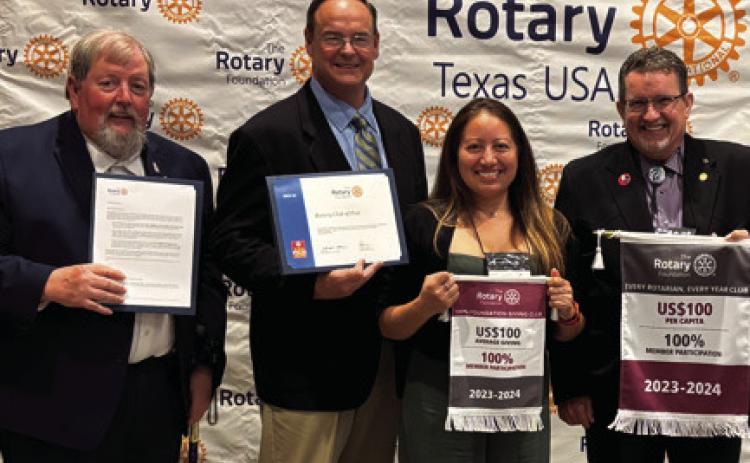 CLUB AWARDS Post Rotarians hold awards that were received at the 2025 District Conference. Pictured from the left, Lynn Simpson, Club President; Rhett Parker, President-Elect; Xochitl Anderton, Immediate Past President; and Chris Atkinson, Club Foundation Chairman. | COURTESY PHOTO