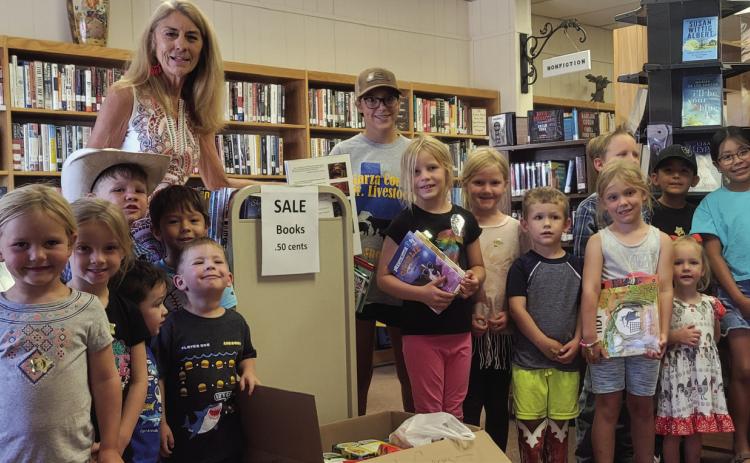 The Post Public Library Summer Reading program ended last week. The kids are presenting Pixie Grisham with boxes of food collected for Post Cares. The library took in cans of food with overdue books along with fines forgiven. Librarian Pam Humble said the food drive was a success. PHOTO PROVIDED