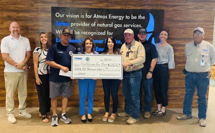 COMMUNITY SUPPORT Jake Hantz, representing Atmos Energy, presented a $25,000 donation to the Post Volunteer Fire Department, reflecting the company’s continued commitment to supporting local first responders and strengthening the community. From left are Hantz, Brandi Price, Jimmy Valdez, Nora Caballero, Elsa Longoria, Kevin Larpenter, Derrick Smith, Bradie Armstrong and Steven Rocha. See ATMOS, page 8. | COURTESY PHOTO