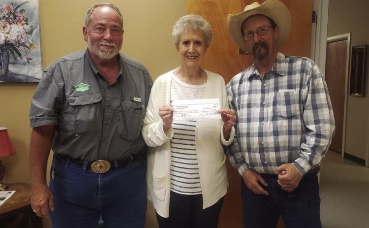 FUNDRAISER Masonic Lodge 2058 of Post presents a check to Garza CountyTrailblazers in the amount of $4,068 to help with the replacement of an air conditioner for the center. Presenting the gift to LaGayluah McReynolds are David Clark, currentWorshipful Master, and MarkWheeler, past Worshipful Master, of Masonic Lodge 2058. The gift is the result of a raffle fundraiser held by the lodge over the last three months. | COURTESY PHOTO