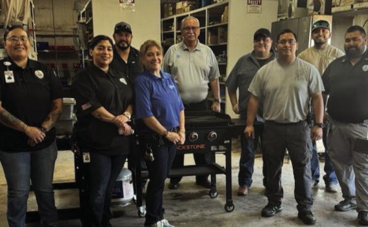 HOT BREAKFAST Giles W. Dalby Facility staff provided breakfast for the Post High School staff, trainers, and both the JV and Varsity teams Thursday. Pictured in front, left to right are Programs Manager Ashlee Cuellar, SIS Marina Cabrera, Admin Assistant Teresa Gomez, SIS Supervisor John Hernandez, and Sergeant Jeremiah DeLeon. Back row: Maintenance Supervisor Zack Sanchez, Warden Ricardo Martinez, SIS Jo Ramirez, and SIS Miguel Gomez. | PHOTO PROVIDED.