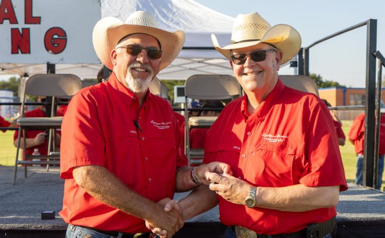 TIME TO RETIRE AND RAISE COWS Greg Henley (right) will retire as CEO of Lyntegar Electric Cooperative this month after a 40-year career with the cooperative. Board president Ben Franklin presented a token of appreciation from the organization. | COURTESY PHOTO