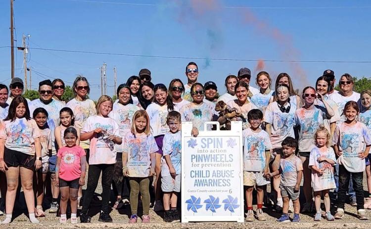 CHILD ADVOCACY Participants gather after the Garza County Child Welfare Board’s inaugural Color Run in Post, covered in colored powder following the race to raise awareness for child abuse prevention. SEE MORE PHOTOS PAGE 8 | COURTESY PHOTO